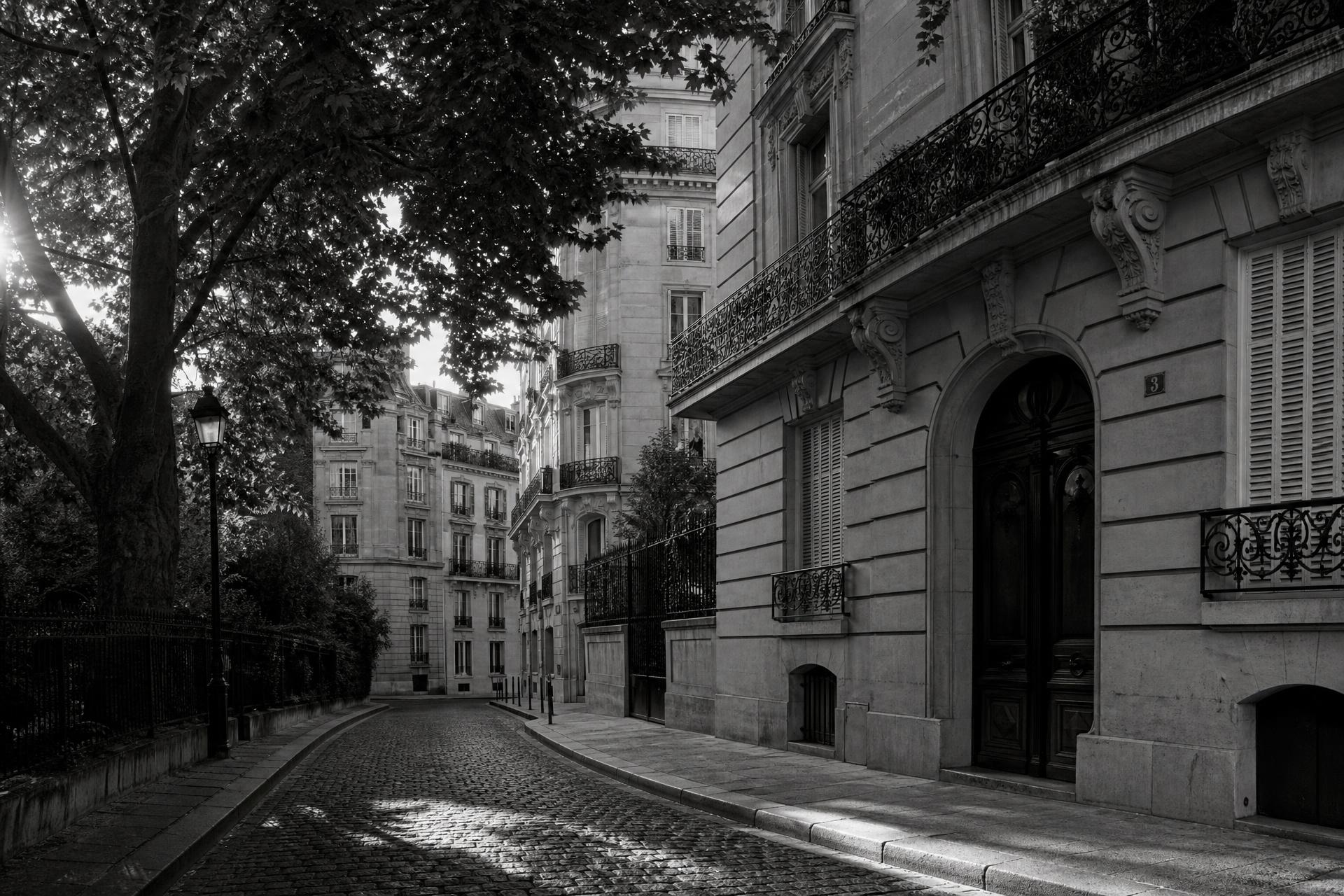 Classic Parisian residential street with limestone facades and cobblestones